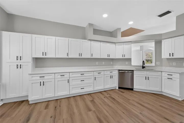 Kitchen remodel with plethora of cabinets and quartz countertops