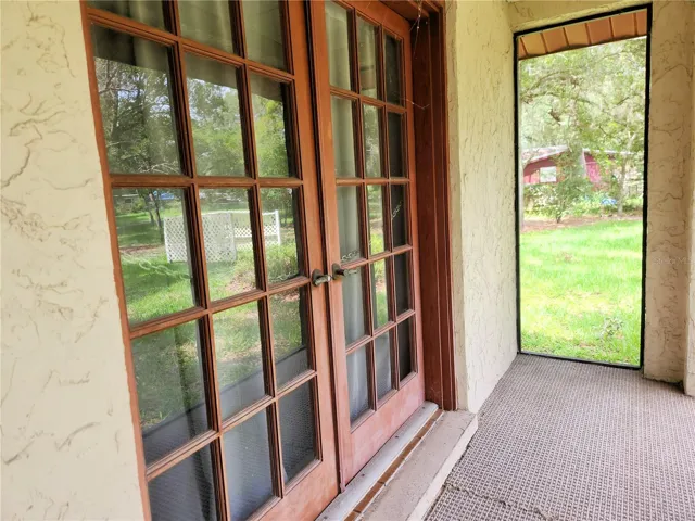 FRENCH DOORS FROM LANAI INTO DINING ROOM