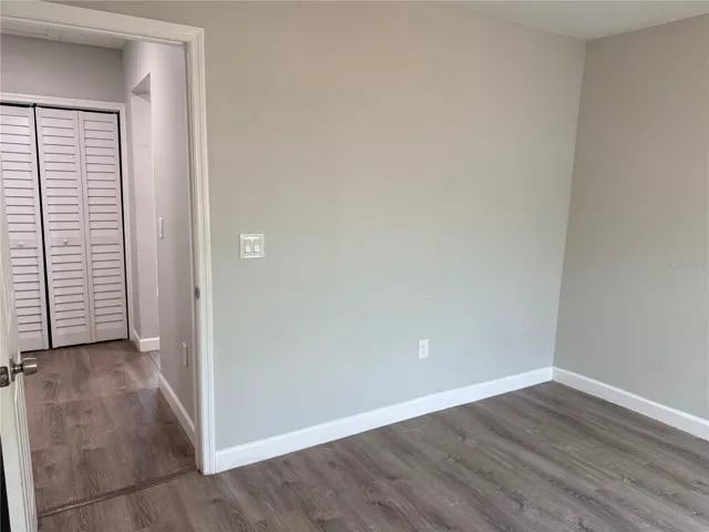 Water heater & AC handler behind bifold doors in hallway.