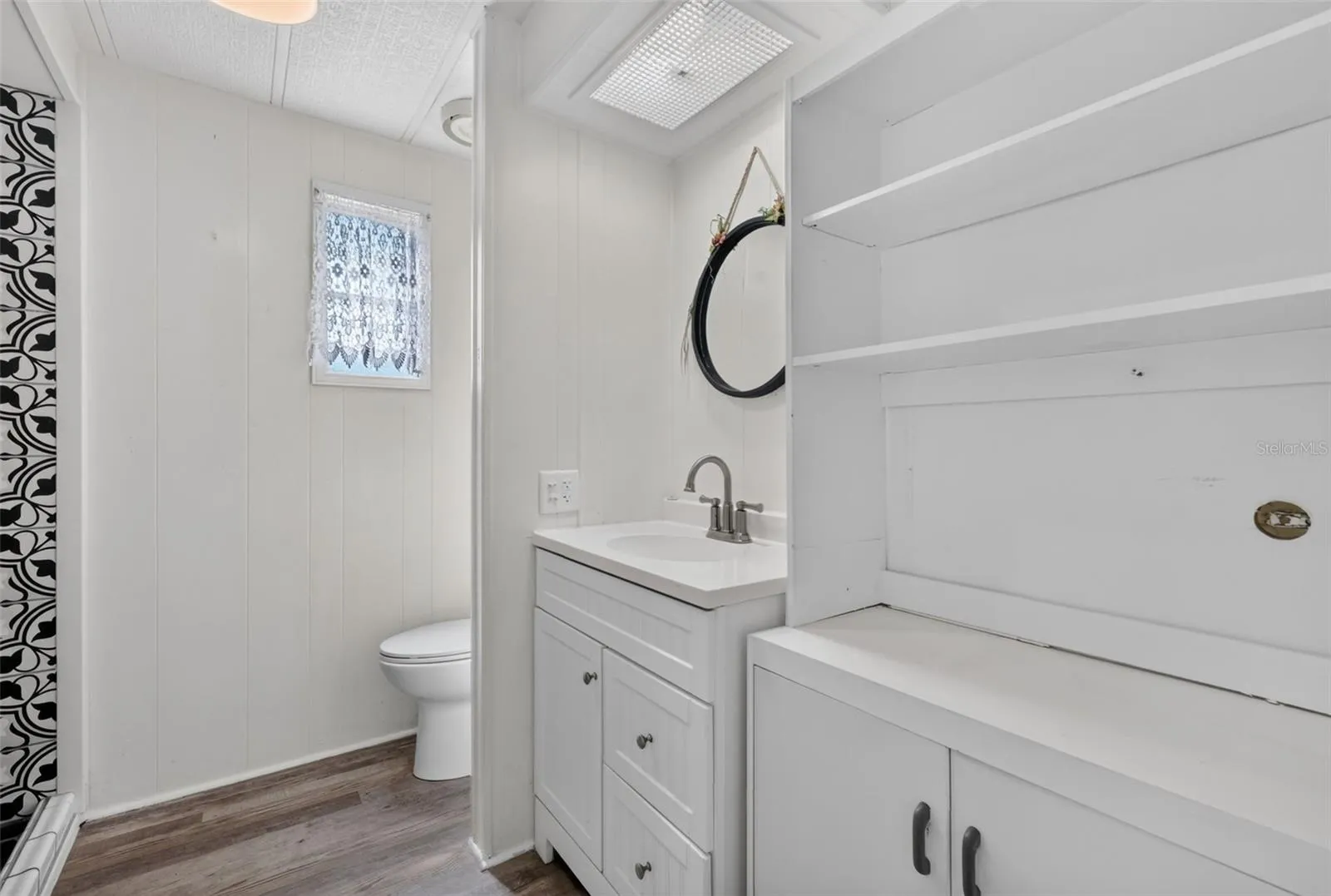 Guest bath w/ample cabinet storage