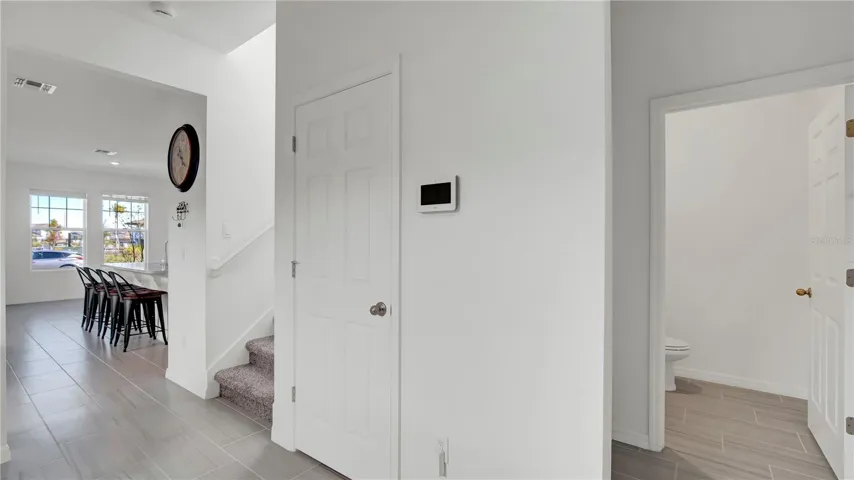 Leading to the flex room showing upstairs/half bathroom