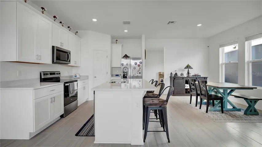 Kitchen showing great room as well