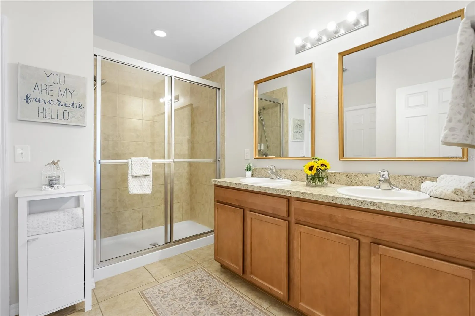 En-suite Bathroom with walk in shower and two walk-in closets.