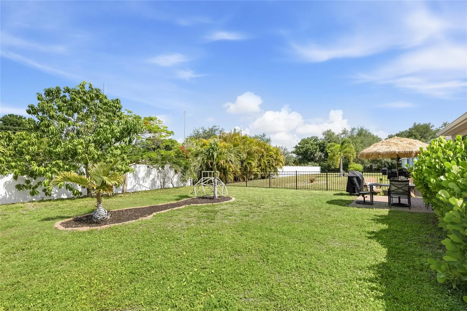 Paver Patio off the Lanai to extend the functional outdoor apace and a large complete fenced in yard.