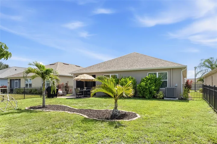 Paver Patio off the Lanai to extend the functional outdoor apace and a large complete fenced in yard.
