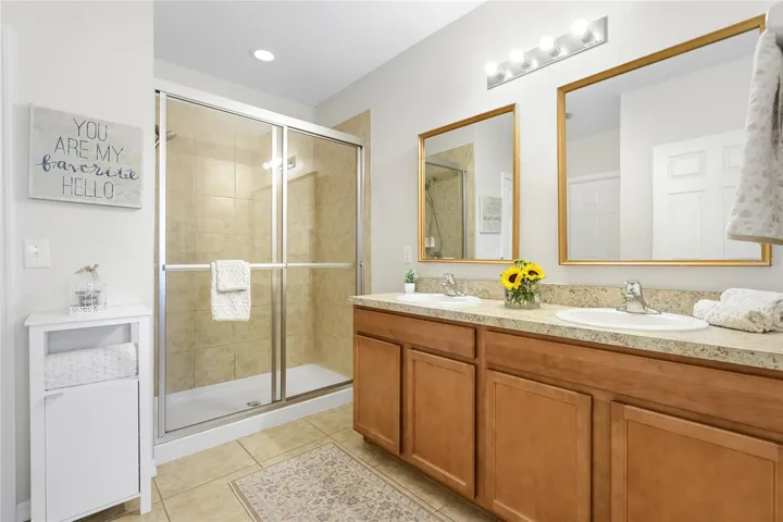 En-suite Bathroom with walk in shower and two walk-in closets.