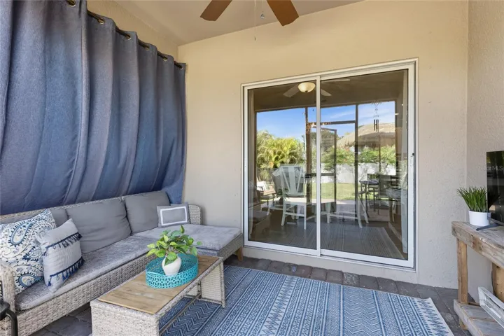 Sliders off Kitchen to Lani with new screens, outdoor light and Fan and set-up for a TV.