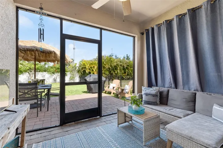Sliders off Kitchen to Lani with new screens, outdoor light and Fan and set-up for a TV.