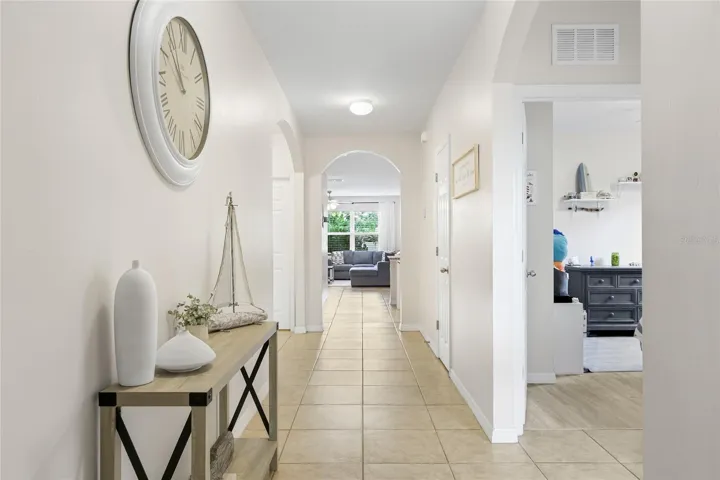 Beautiful long and wide foyer and hallway to an open concept living area