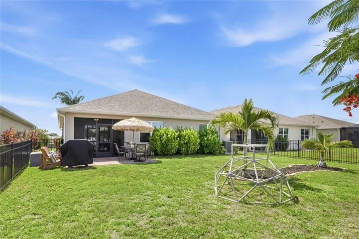 Paver Patio off the Lanai to extend the functional outdoor apace and a large complete fenced in yard.