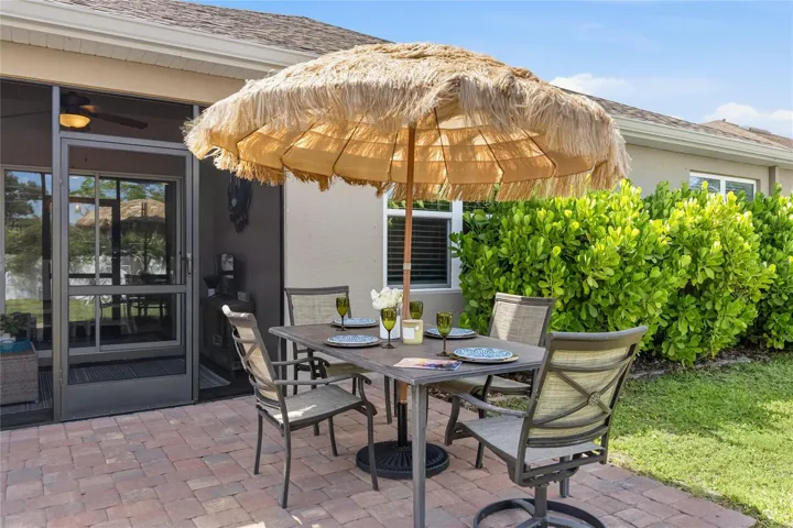 Paver Patio off the Lanai to extend the functional outdoor apace and a large complete fenced in yard.