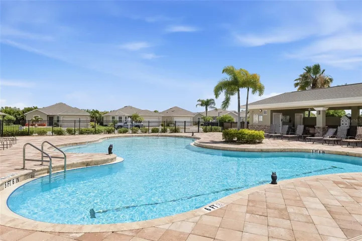Large Community Pool with lounge chairs for sunbathing. Covered Pavilion with outdoor tables and chairs to enjoy lunch, dinner or a snack while getting out of the sun. Restrooms available as well.