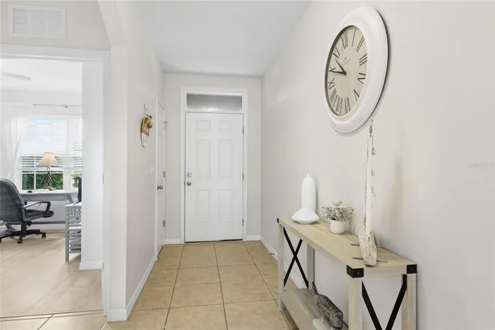 Beautiful long and wide foyer and hallway to an open concept living area