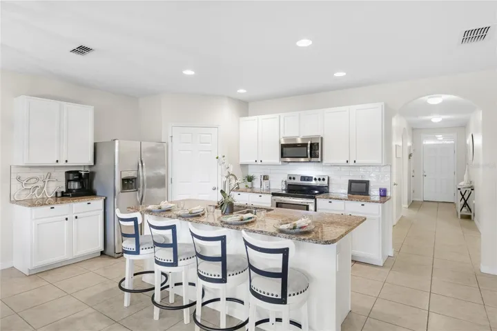 Large Kitchen with Grande Island and abundant seating space for functional living and entertaining.