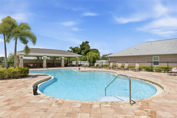 Large Community Pool with lounge chairs for sunbathing. Covered Pavilion with outdoor tables and chairs to enjoy lunch, dinner or a snack while getting out of the sun. Restrooms available as well.