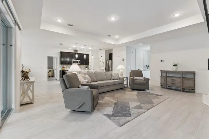 Spacious Living room with Tray Ceilings