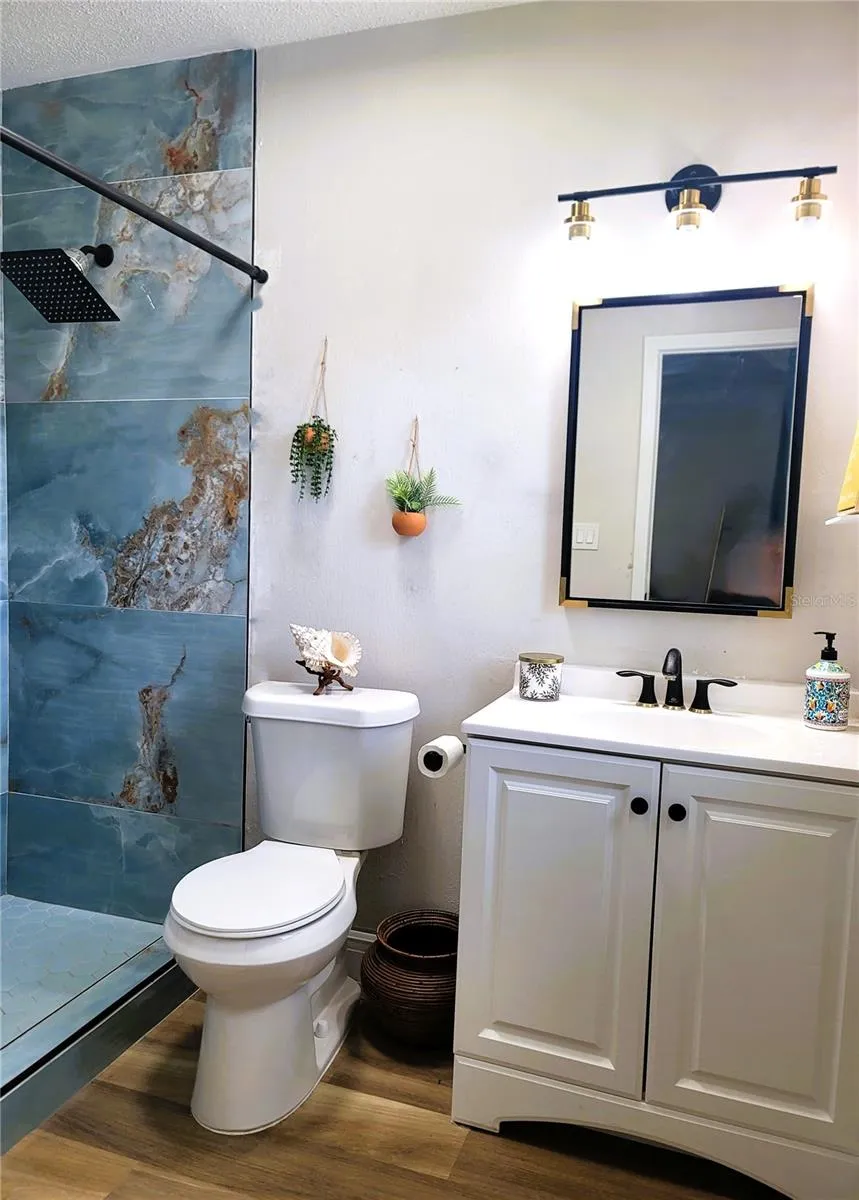Primary Bathroom - and BEAUTIFUL custom tile walk-in shower.... 2 shower heads