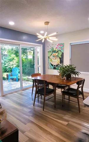 Ample Dining Room space and sliders to your private fenced back yard