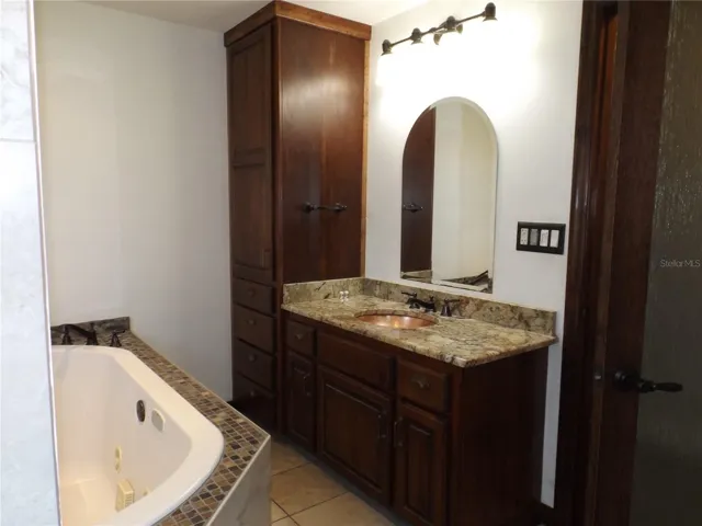 Single vanity with storage cabinets