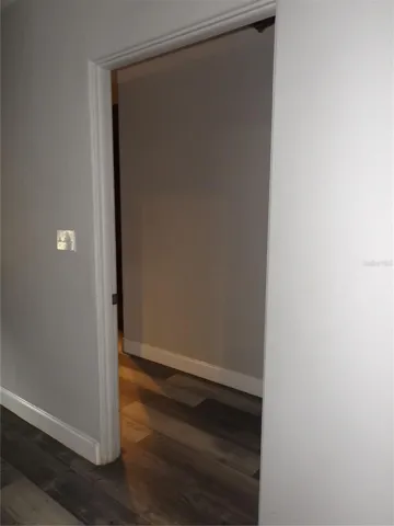 Entryway to main floor bedroom/closet/bathroom from dining area