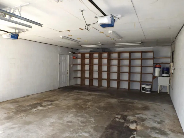 Garage with storage, utility sink (hooked up and operable)