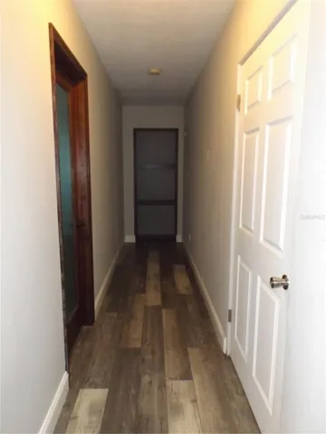 hallway to the main bath (to the left) and main room on first floor at the end of the hall.