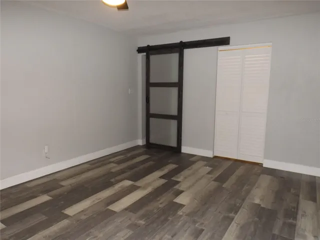 Main bedroom barn door entrance from hall