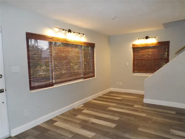 Informal living/game area with staircase that leads to top floor