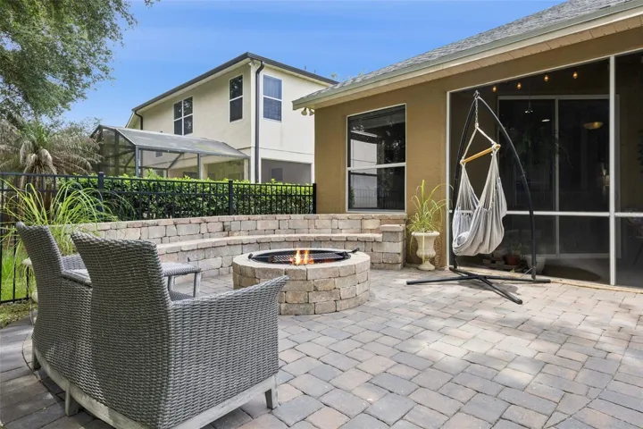 Brickpaved Patio with built in Bench, Firepit and Grill