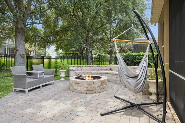 Brickpaved Patio with built in Bench, Firepit and Grill