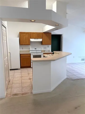 View of Kitchen over bar area