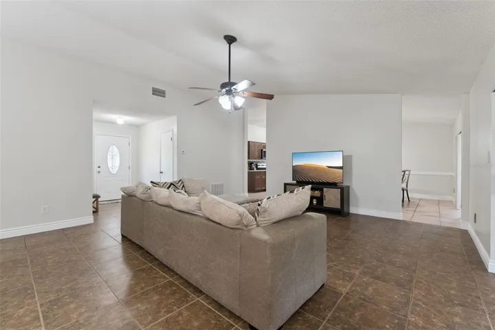 Living Room with view to the front foyer and kitchen