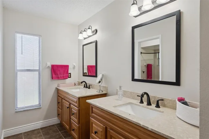 Primary bedroom bath with two sinks