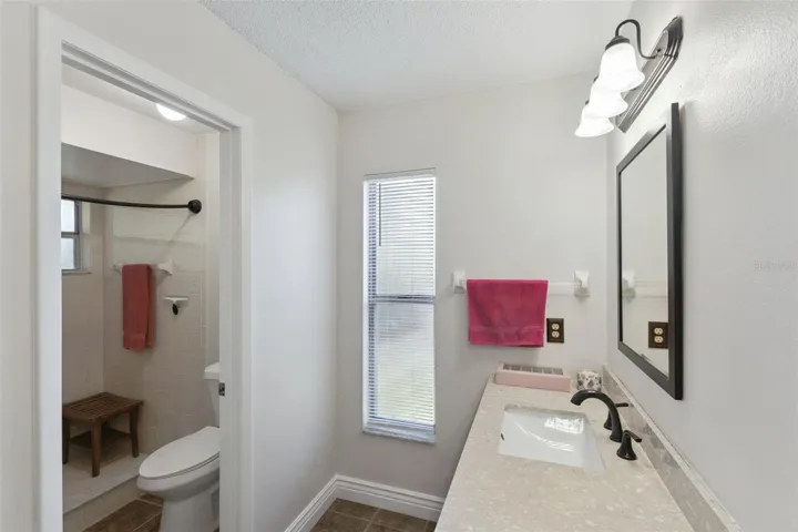 primary bedroom bath with private shower and toilet