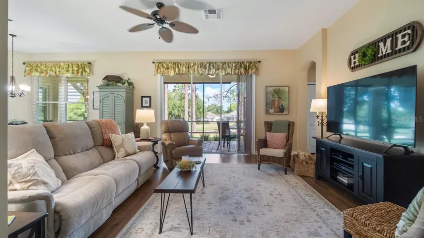 Family Room With Sliders Leading to Paver Lanai