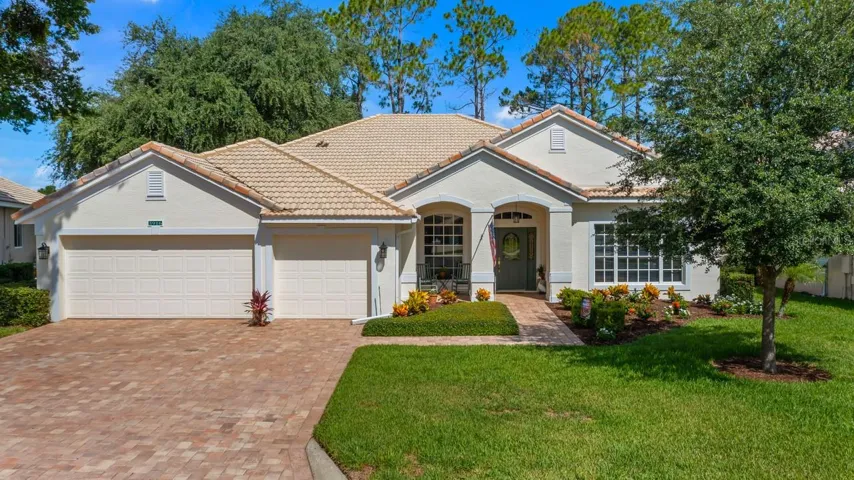 Front of Home With Paver Driveway and Walkway