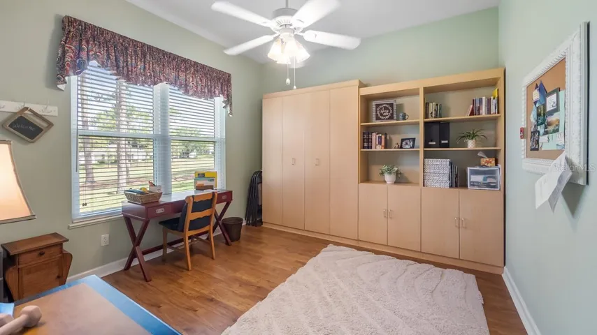 Bedroom 2 With Built In Murphy Bed Overlooking the Golf Course With Walk In Closet
