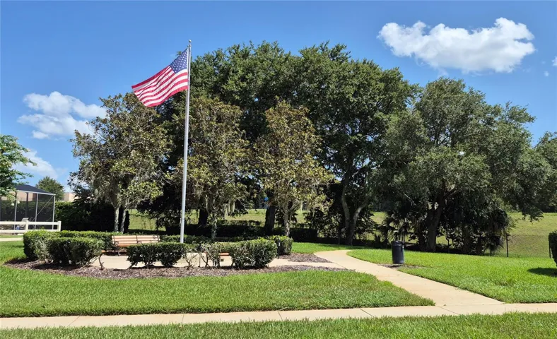 Flag Pole Park and Private Gate to School