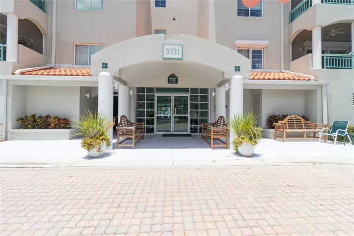Building Entrance, The parking garage entrance is to the left of the door.