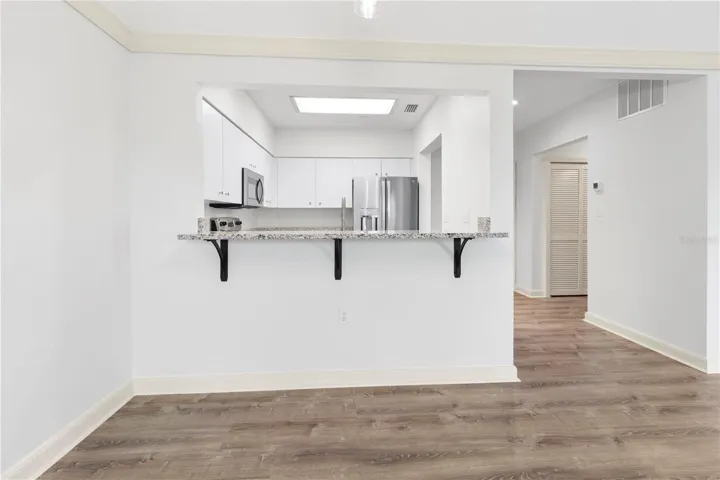 Passthrough to the kitchen from the dining room.