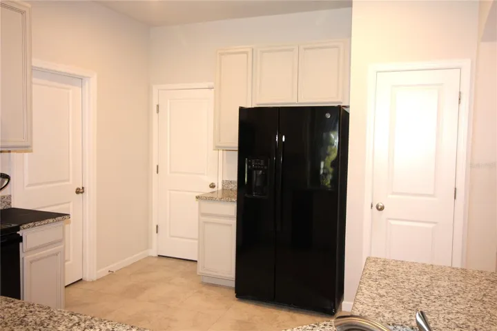 door on far left to laundry, next door is to garage, and door on right is to pantry