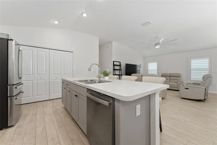 Kitchen island with open sightline to the living room in the Emerald IV.