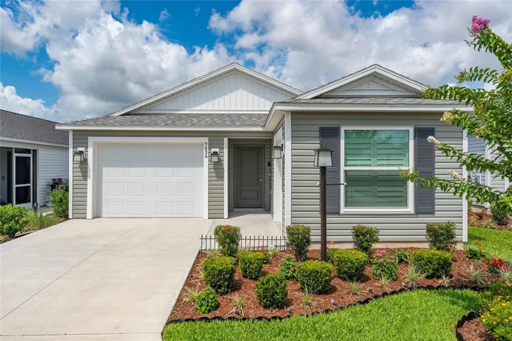 Front elevation of the Emerald IV in Avery Villas with maintained landscaping.