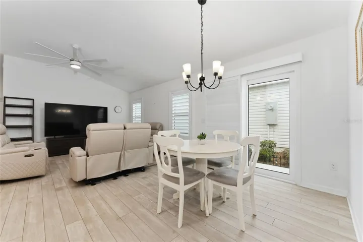 Open dining and living area with bright interior layout.