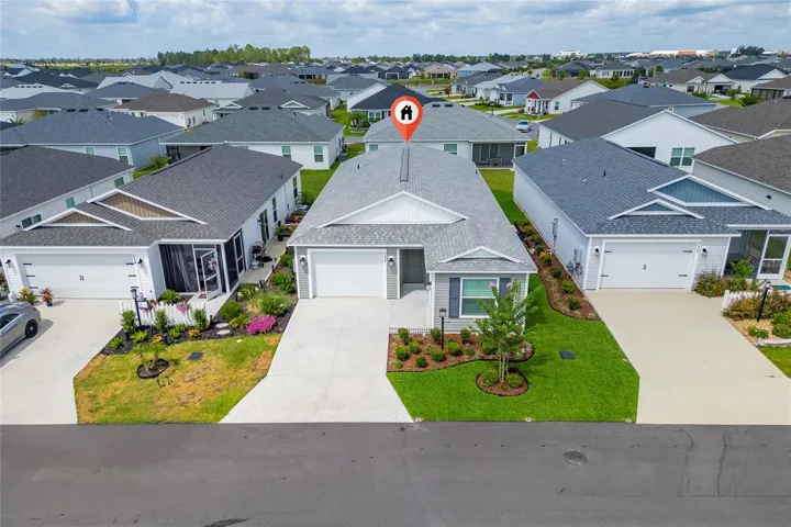 Front aerial view with marker identifying the home location in Avery Villas.