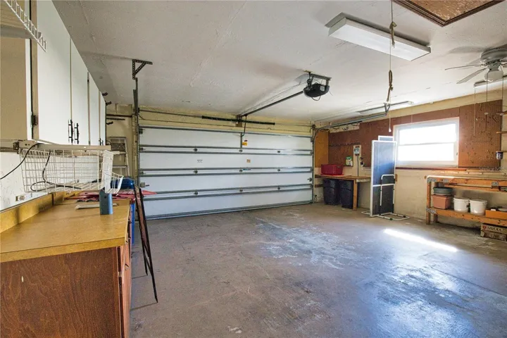 Spacious garage with window &amp; a door to outside