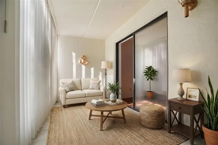Extend Your Living Space. The enclosed screened lanai provides a comfortable setting to relax while enjoying the peaceful, tree-lined surroundings. Virtually staged photo.