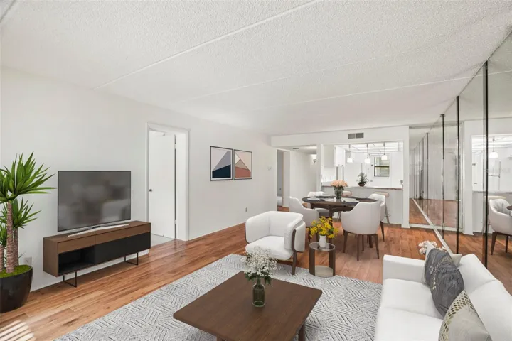 An Easy Flow. The breakfast bar connects the kitchen to the living and dining areas, creating a layout that's both spacious and functional.