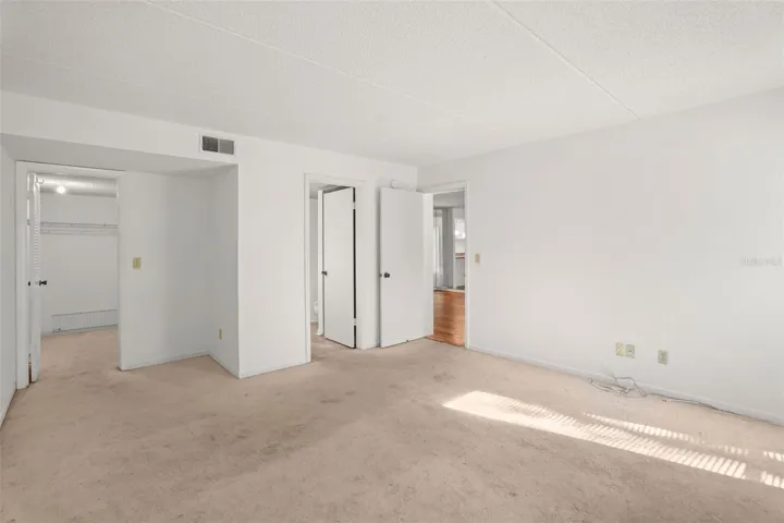 A Comfortable Primary Suite. The spacious bedroom includes a walk-in closet and private en suite bath, creating a layout designed for comfort and convenience.