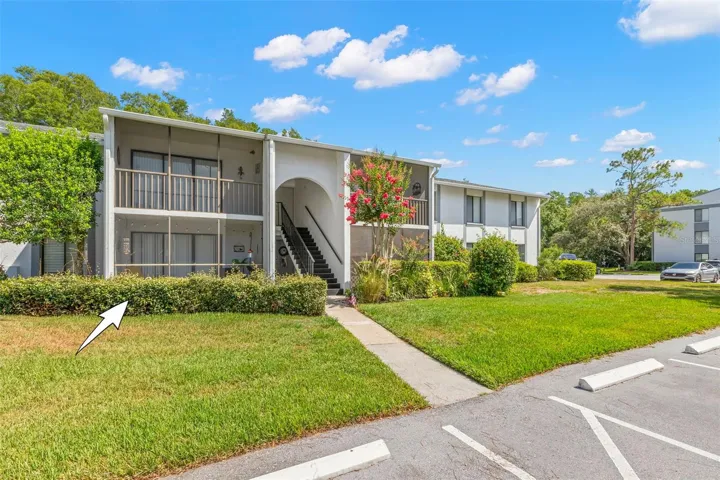 Attractive landscaping, mature trees, and convenient first-floor living make a wonderful first impression.